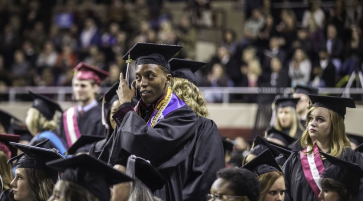 a student moves their tassel during commencement